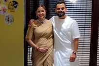 Pregnant Anushka Sharma Cradles Her Baby Bump In NEW Photo With Virat Kohli? Here's A Fact-Check