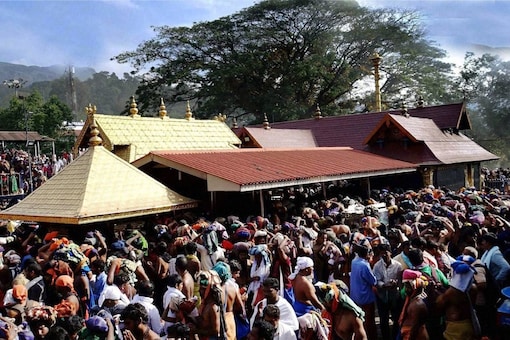 Devotees throng around sanctum sanctorum at Sannidhanam in Sabarimala. (PTI Photo)